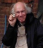 Colin with Colin the caterpillar cake at John Scott's Farm.